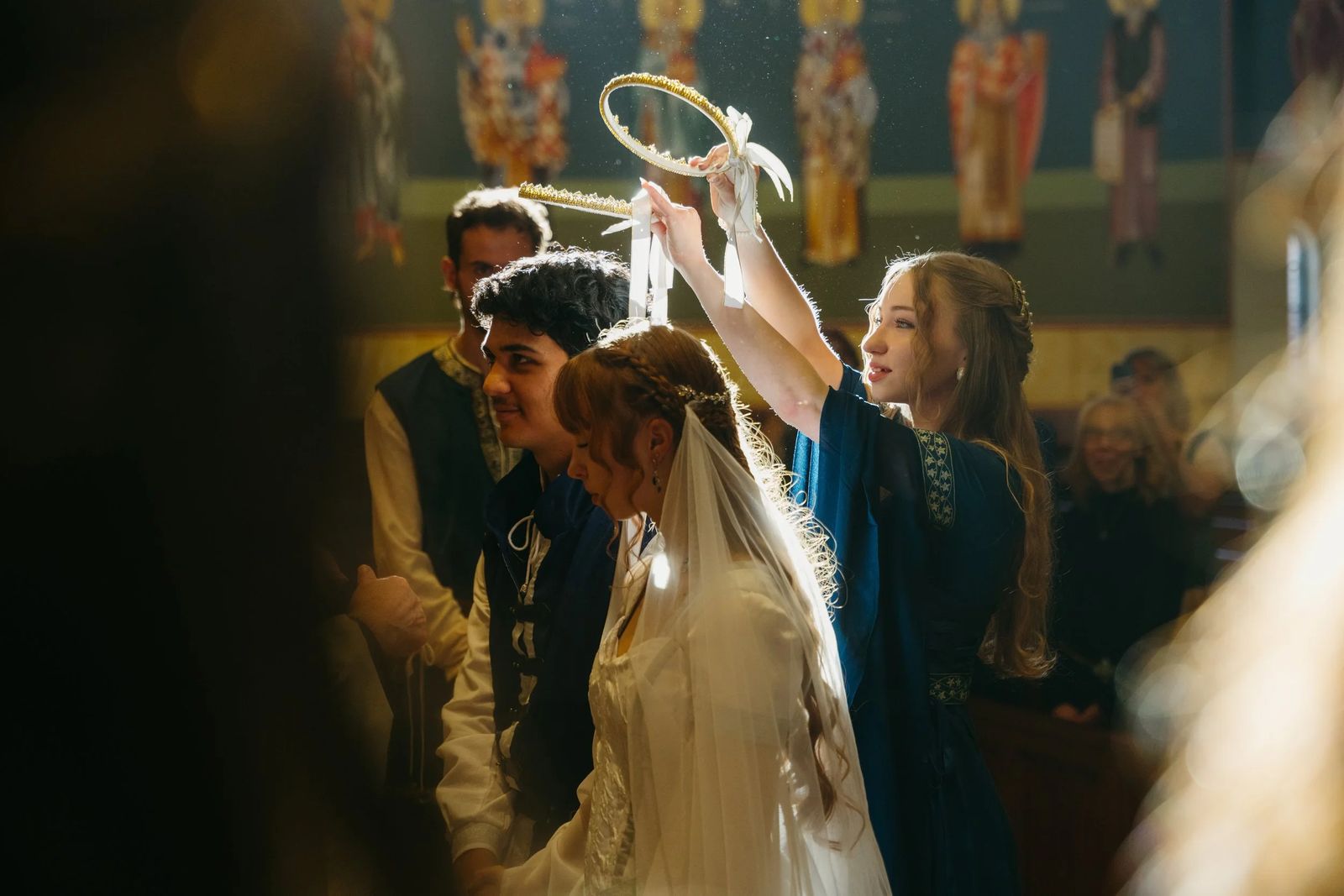 A wedding moment beneath a crown