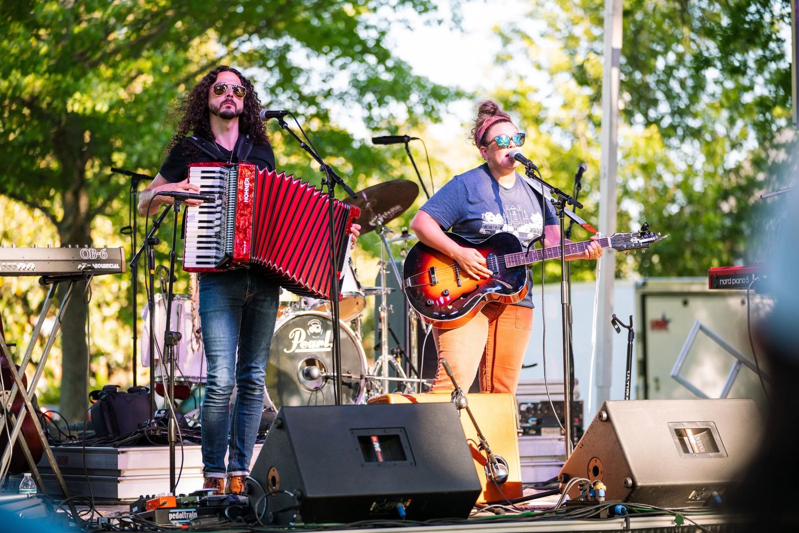 A band performing on an outdoor stage